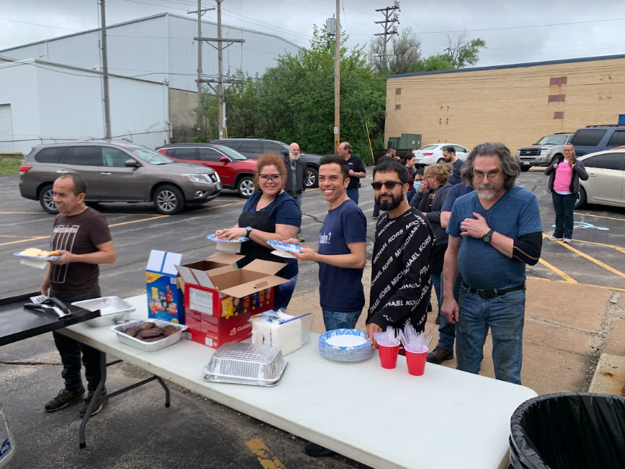Winco employees enjoying a Memorial Day cookout in the parking lot
